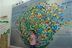  Girl in front of the map with wishes. 